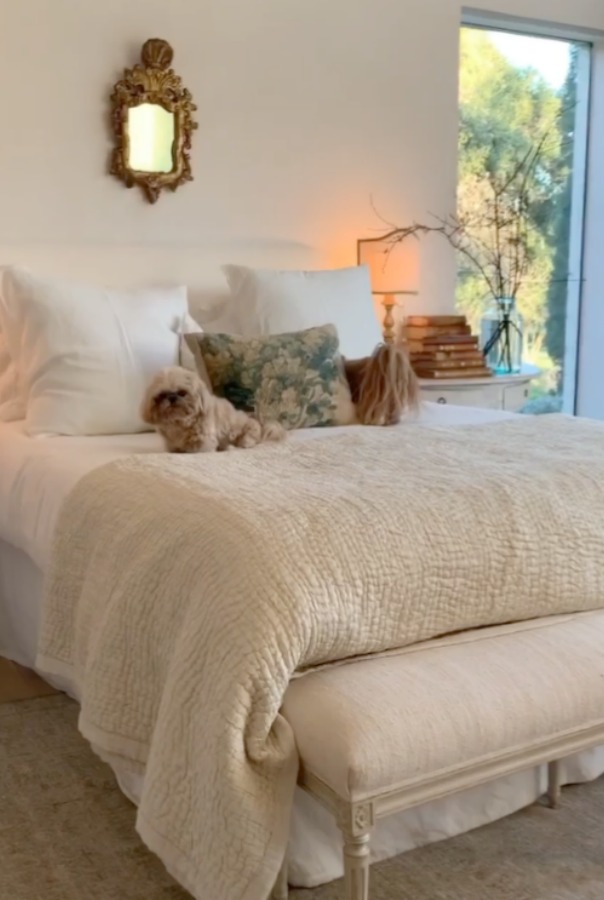 Romantic bedroom at Patina Farm (a European country farmhouse by Giannetti Home) has antiques from Sweden, sumptuous linens, a French stone fireplace, and rustic elegant charm. #interiordesign #bedroomdesign #europeancountry #frenchfarmhouse #patinafarm #brookegiannetti