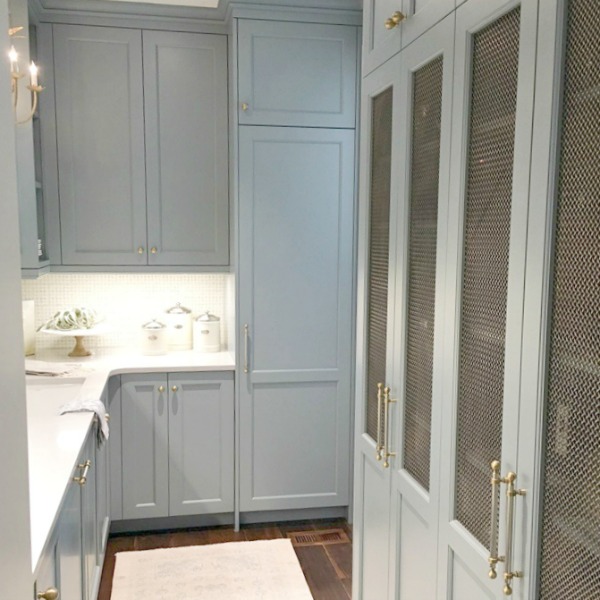 Atlanta Southeastern Designer Showhouse 2017 kitchen with Farrow & Ball Light Blue cabinets and brass hardware. Elegant Blue Kitchen Design: What Makes it Timeless?