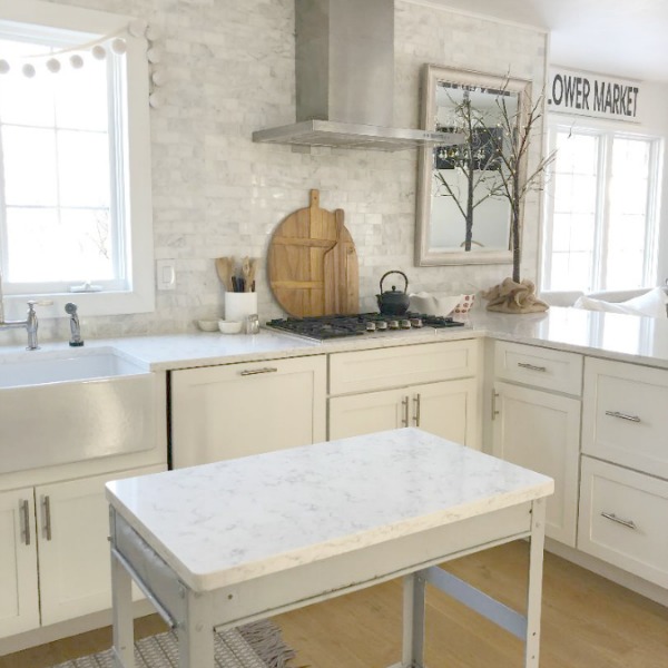 Minuet Viatera quartz countertop in our classic white kitchen with Shaker cabinets and stainless appliances. #hellolovelystudio #whitequartz #countertops #kitchendesign #minuet #viateraquartz #lgviatera