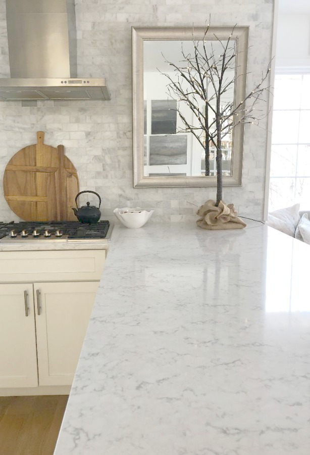 Minuet Viatera quartz countertop in our classic white kitchen with Shaker cabinets and stainless appliances. #hellolovelystudio #whitequartz #countertops #kitchendesign #minuet #viateraquartz #lgviatera