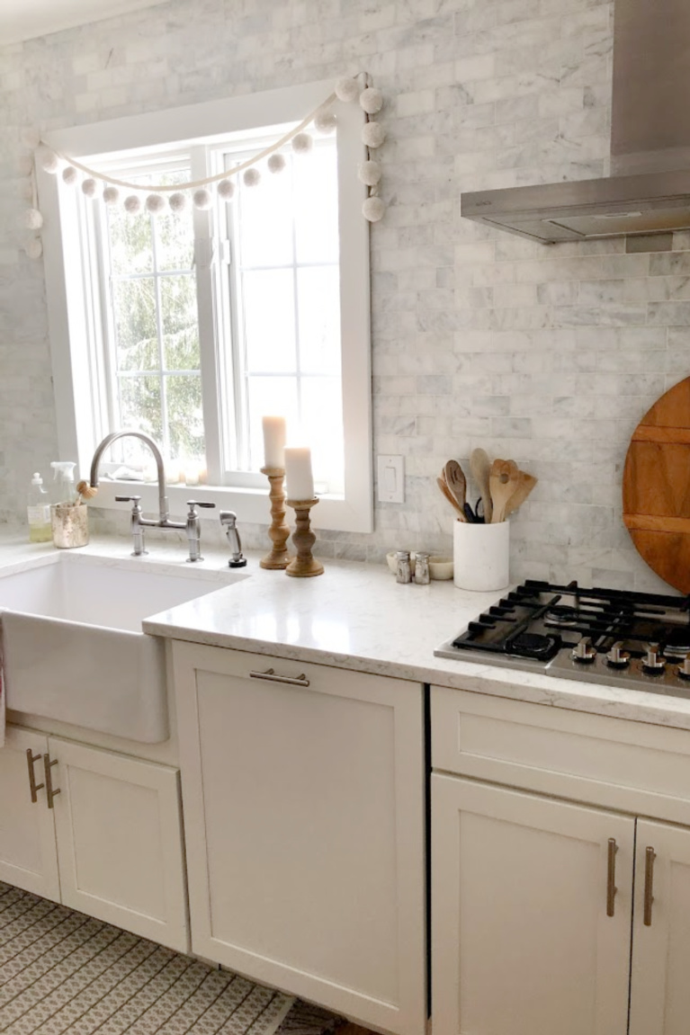 Viatera Minuet quartz countertop in my classic white kitchen (with Modern French influence) paired with polished marble subway tile backsplash - Hello Lovely Studio. #whitequartz #quartzcountertops #minuet