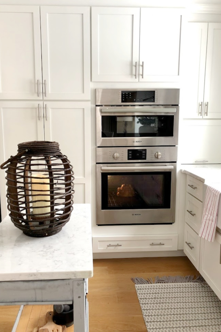 Viatera Minuet quartz countertop in my classic white kitchen (with Modern French influence) paired with polished marble subway tile backsplash - Hello Lovely Studio. #whitequartz #quartzcountertops #minuet