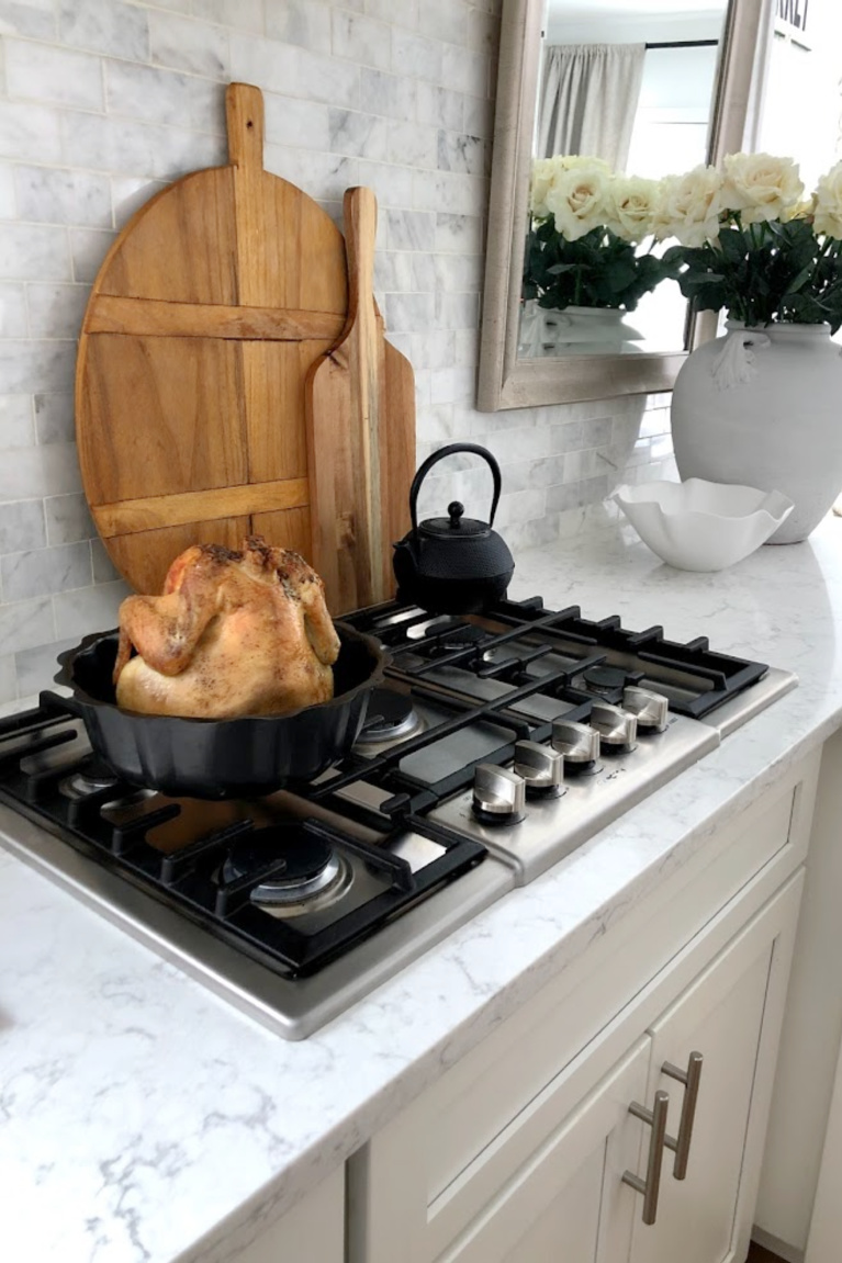 Viatera Minuet quartz countertop in my classic white kitchen (with Modern French influence) paired with polished marble subway tile backsplash - Hello Lovely Studio. #whitequartz #quartzcountertops #minuet