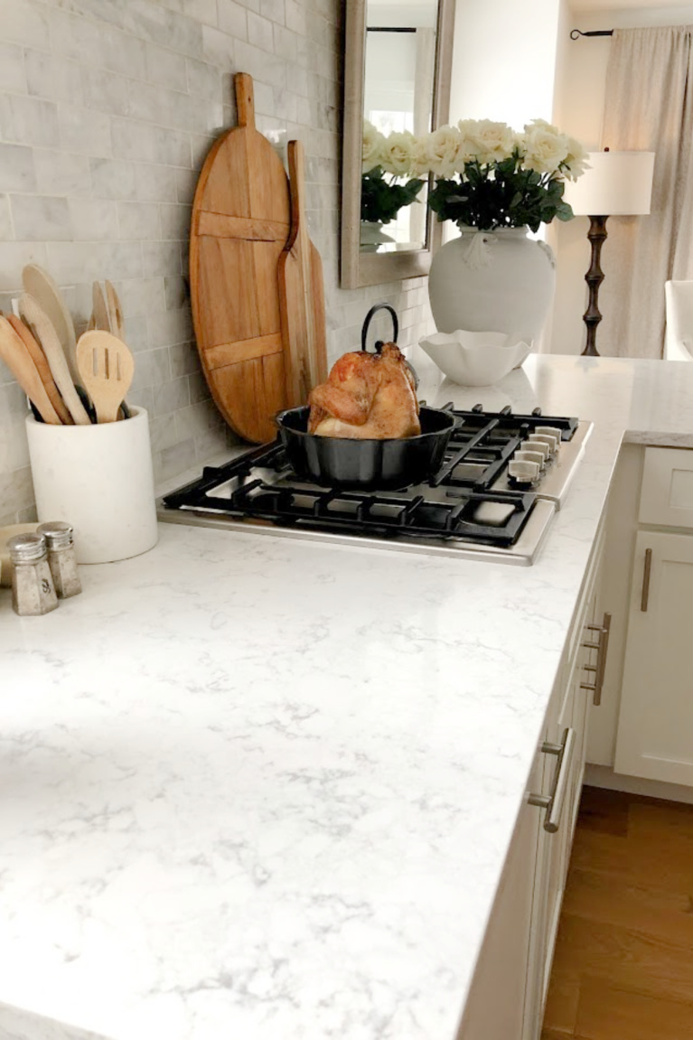 Viatera Minuet quartz countertop in my classic white kitchen (with Modern French influence) paired with polished marble subway tile backsplash - Hello Lovely Studio. #whitequartz #quartzcountertops #minuet