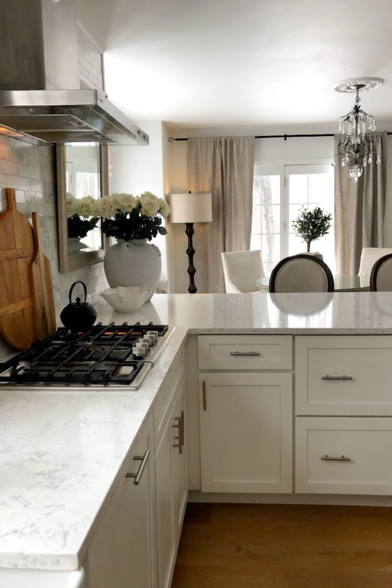 Viatera Minuet quartz countertop in my classic white kitchen (with Modern French influence) paired with polished marble subway tile backsplash - Hello Lovely Studio. #whitequartz #quartzcountertops #minuet