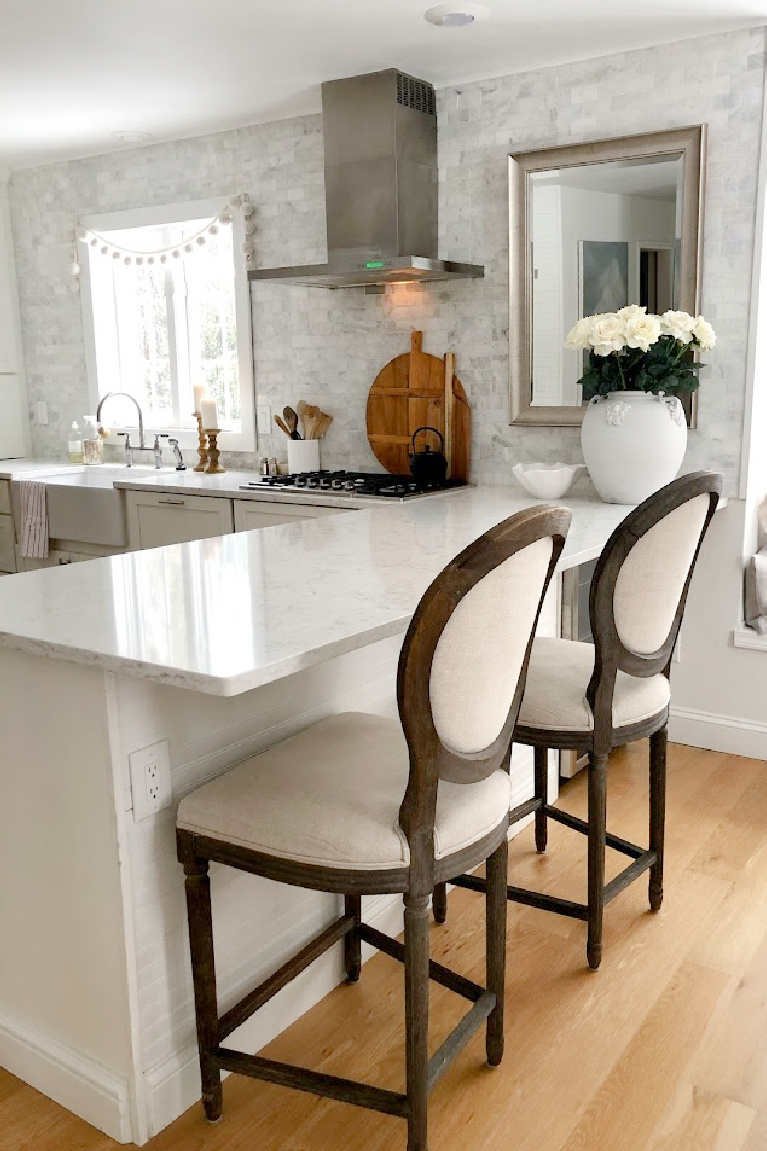 Viatera Minuet quartz countertop in my classic white kitchen (with Modern French influence) paired with polished marble subway tile backsplash - Hello Lovely Studio. #whitequartz #quartzcountertops #minuet