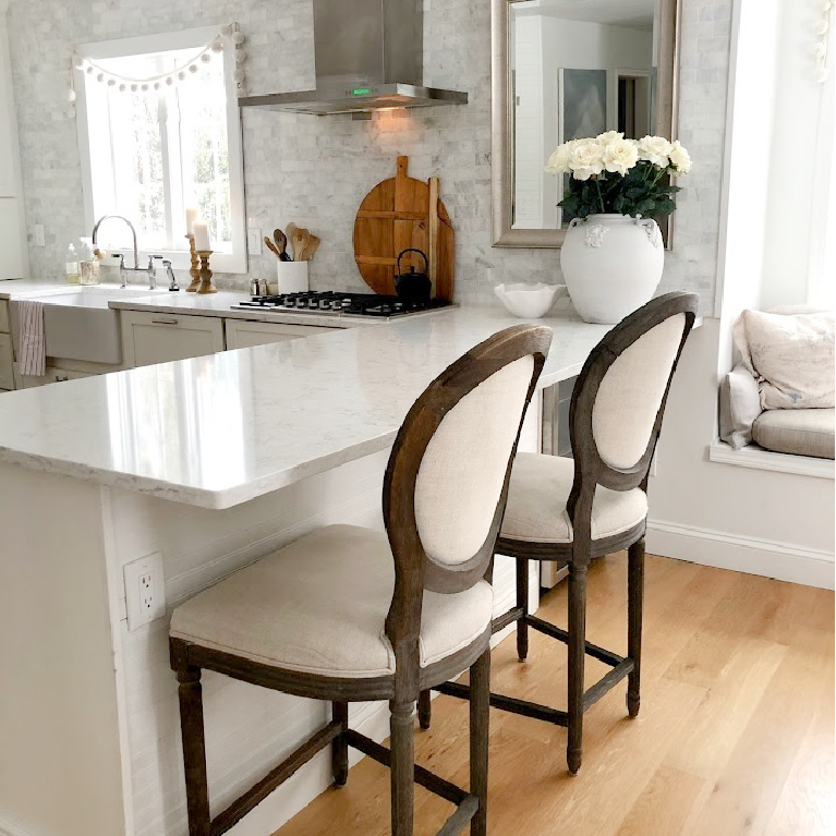 Viatera Minuet quartz countertop in my classic white kitchen (with Modern French influence) paired with polished marble subway tile backsplash - Hello Lovely Studio. #whitequartz #quartzcountertops #minuet