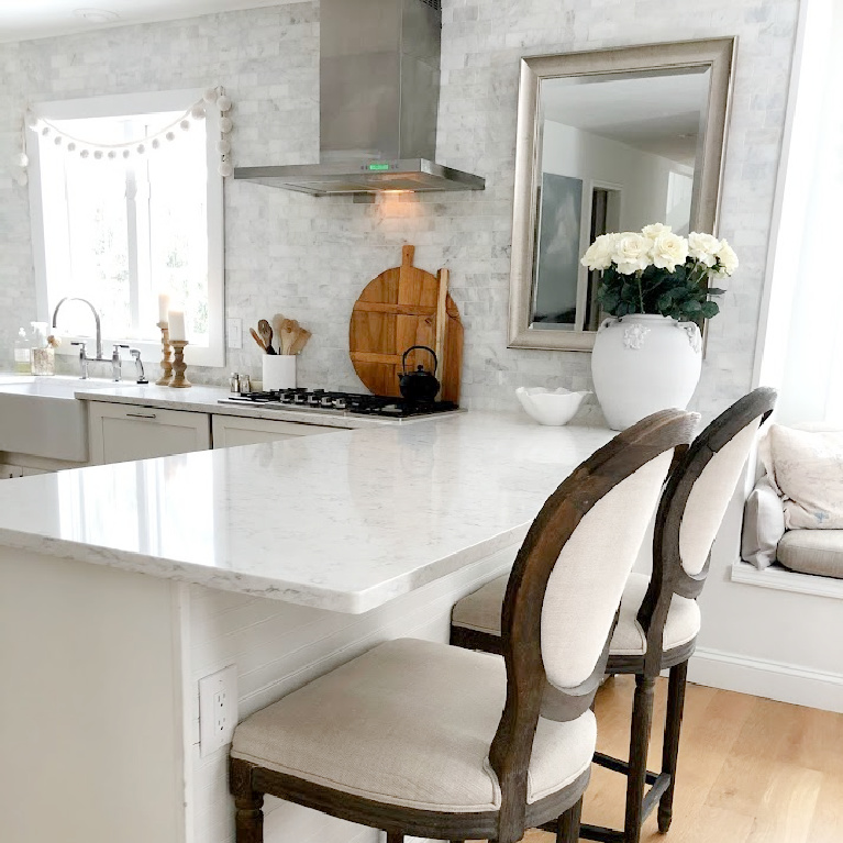 Viatera Minuet quartz countertop in my classic white kitchen (with Modern French influence) paired with polished marble subway tile backsplash - Hello Lovely Studio. #whitequartz #quartzcountertops #minuet