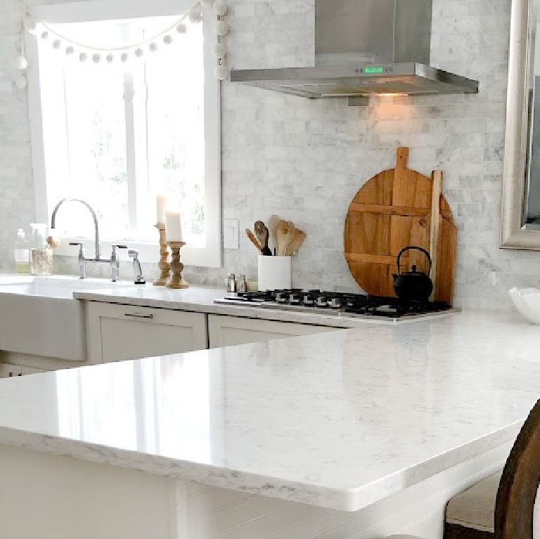 Viatera Minuet quartz countertop in my classic white kitchen (with Modern French influence) paired with polished marble subway tile backsplash - Hello Lovely Studio. #whitequartz #quartzcountertops #minuet