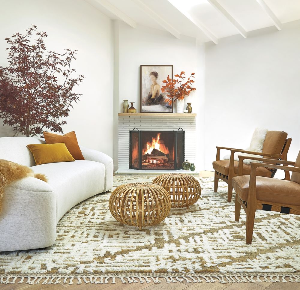 Cozy white living room with rustic accents and an airy coastal organic Cali vibe - Lulu & Georgia. #whitedecor #livingroom #casualstyle #interiordesign #neutraldecor