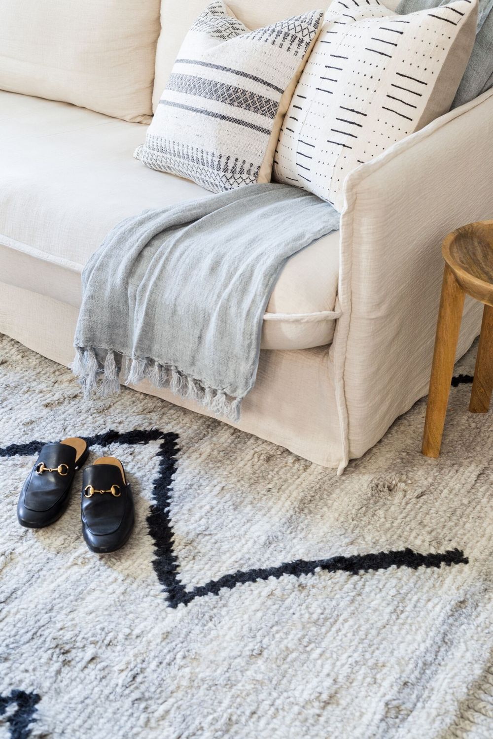 Cozy white living room with rustic accents and an airy coastal organic Cali vibe - Lulu & Georgia. #whitedecor #livingroom #casualstyle #interiordesign #neutraldecor