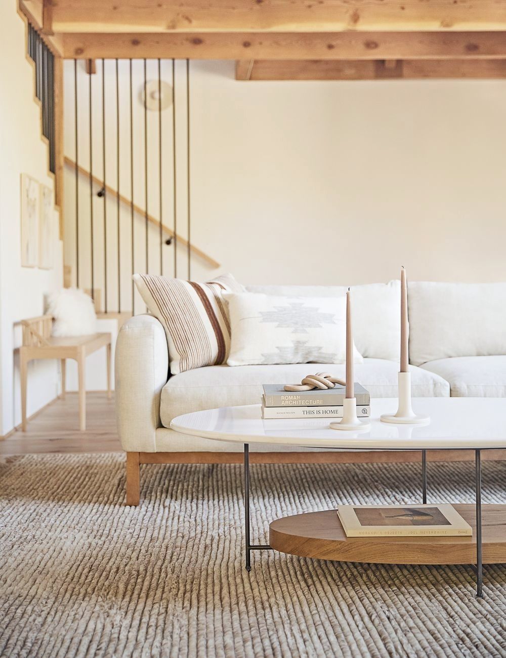 Cozy white living room with rustic accents and an airy coastal organic Cali vibe - Lulu & Georgia. #whitedecor #livingroom #casualstyle #interiordesign #neutraldecor