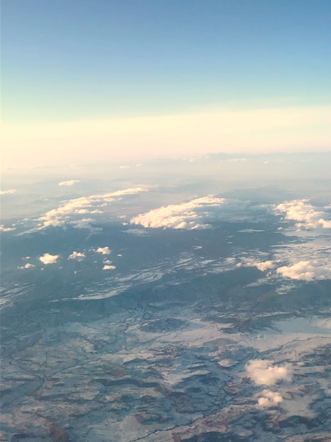 Clouds, blue sky, and ice from airplane - Hello Lovely Studio.