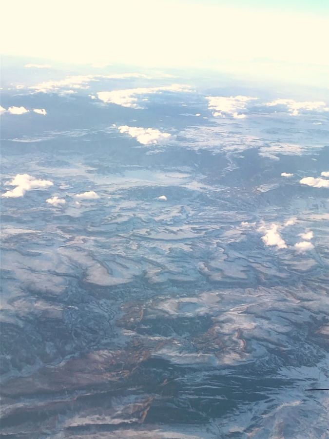 Clouds, blue sky, and ice from airplane - Hello Lovely Studio.