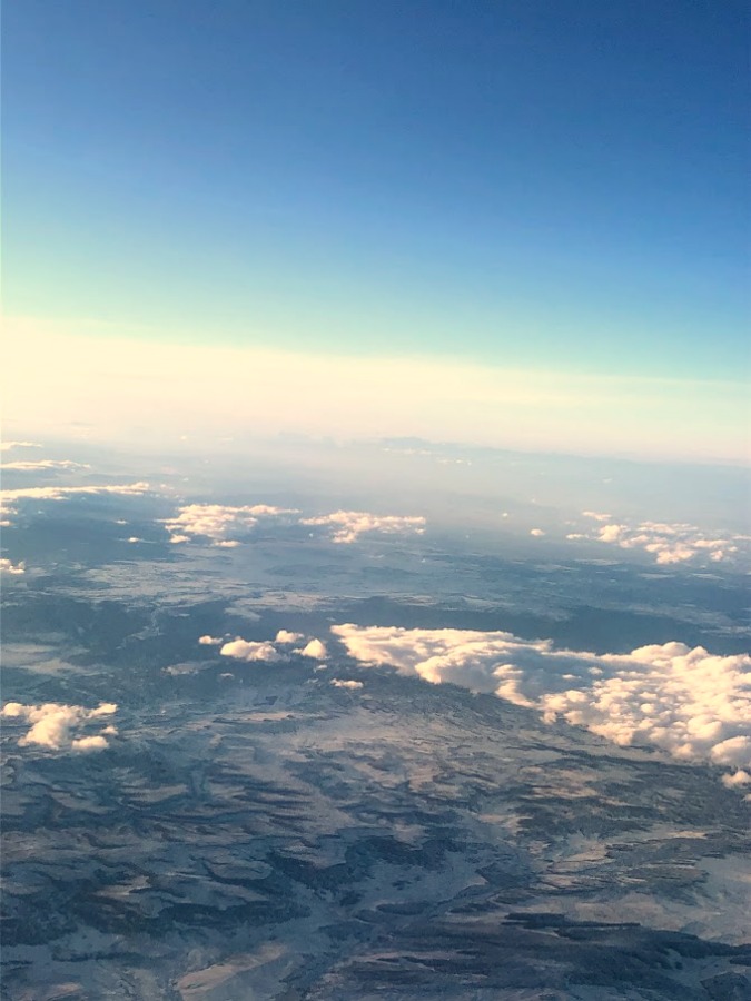 Clouds, blue sky, and ice from airplane - Hello Lovely Studio.