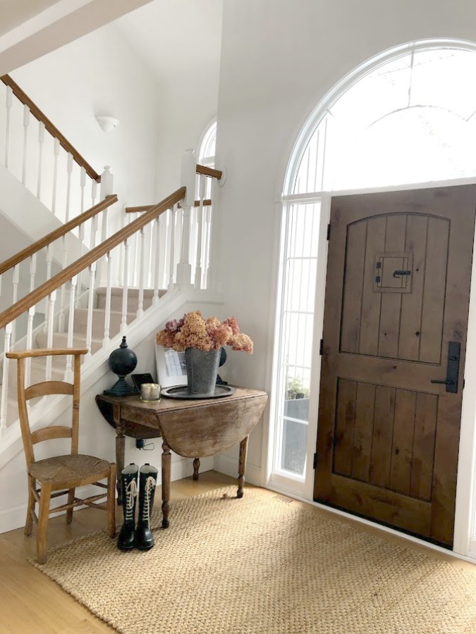 Neutral decor and vintage style in our European country style entry with white oak hardwood flooring - Hello Lovely Studio. #europeancountry #entry #whiteoak #hardwoodflooring