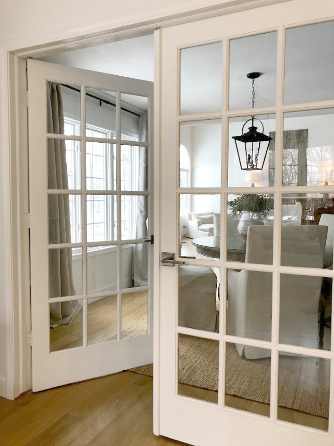 French doors from kitchen to dining room in our European country inspired home - Hello Lovely Studio.