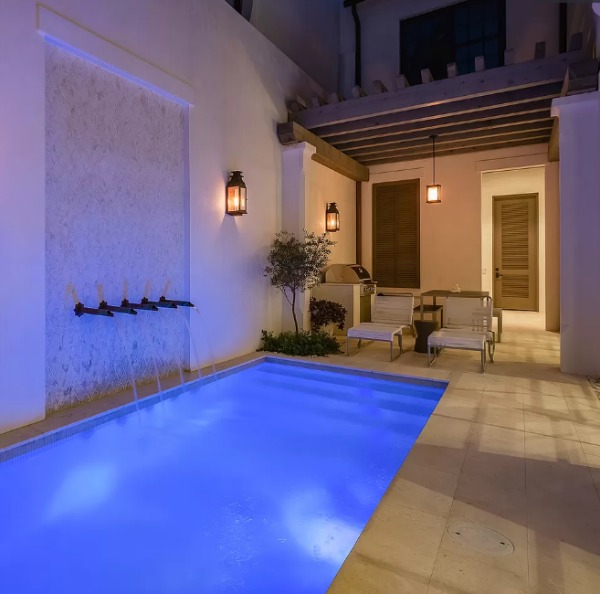 Courtyard pool and water feature at a magnificent coastal home (Alys Beach) by Domin Bock.