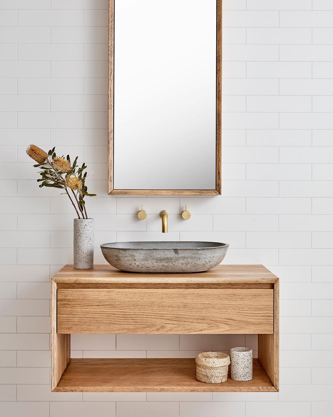 Bespoke wood vanity with vessel sink and white wall of subway tile - Loughlin Furniture. #bespokebathroom #bathroomdesign #customvanity #vesselsink