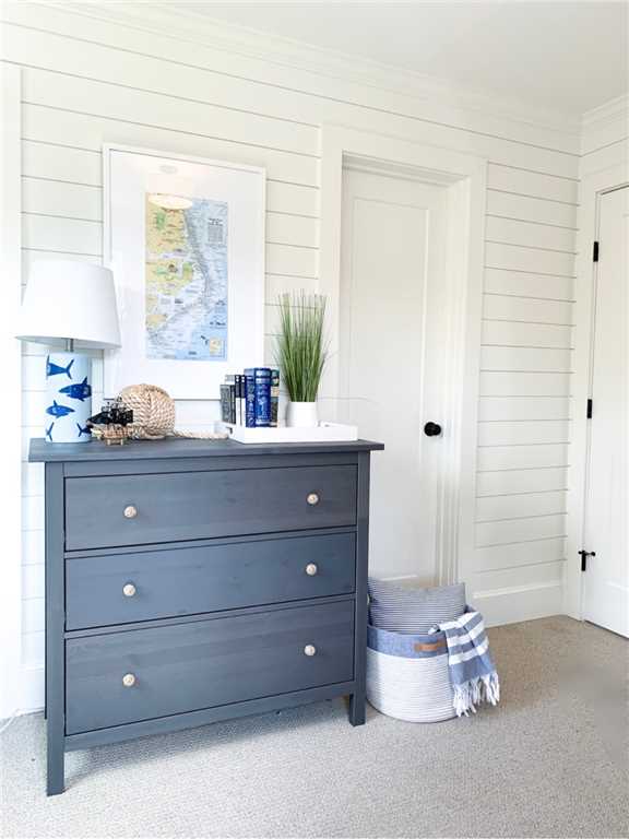 Charming blue and white classic coastal bedroom with shiplap - Summerfell Cottage. #coastalstyle #shiplapwall #blueandwhite #interiordesign #bedroomdecor