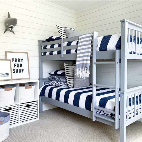 Charming blue and white classic coastal bedroom with shiplap - Summerfell Cottage in NC. #bunkroom #coastalstyle #shiplapwall #blueandwhite #interiordesign #bedroomdecor