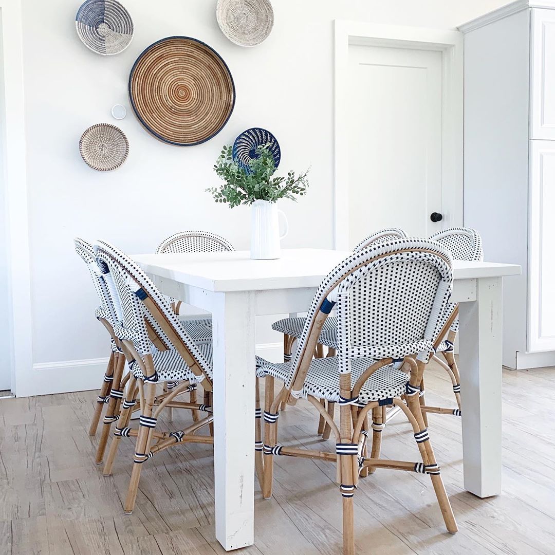 Coastal, minimal, serene blue and white dining room with Parisian bistro chairs in Summerfell Cottage in NC. #diningroom #coastalstyle #blueandwhite #interiordesign #bistrochairs