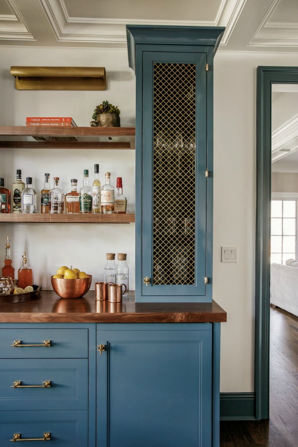 Blue cabinets and open shelves in bar area of magnificent remodeled home by Edward Deegan Architects. #bluecabinets #kitchendesign #openshelving
