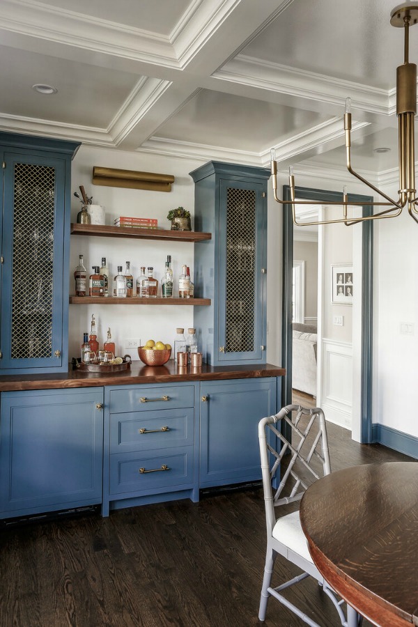 Blue cabinets and open shelves in bar area of magnificent remodeled home by Edward Deegan Architects. #bluecabinets #kitchendesign #openshelving