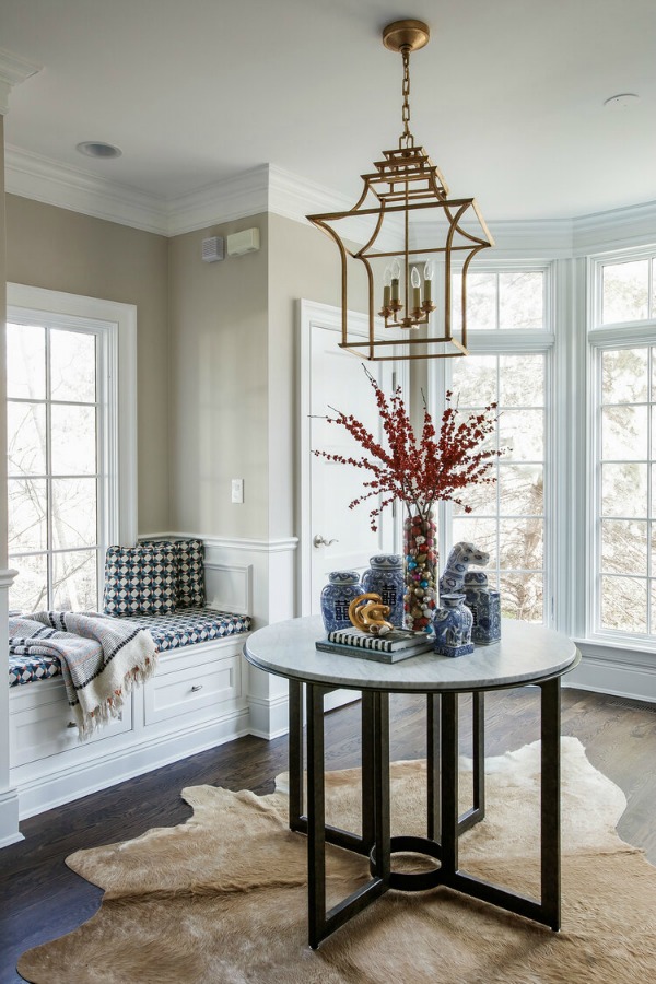 Window seat with blue upholstery in a magnificent kitchen by Edward Deegan Architects. #windowseat #kitchendesign #blueandwhite