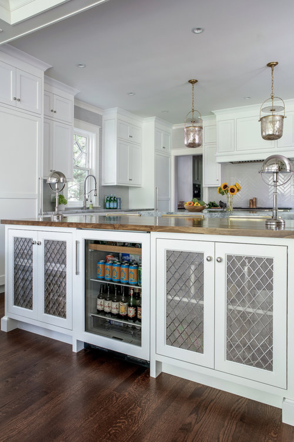 Beautiful classic style in a classic kitchen by Edward Deegan with white Shaker cabinets.