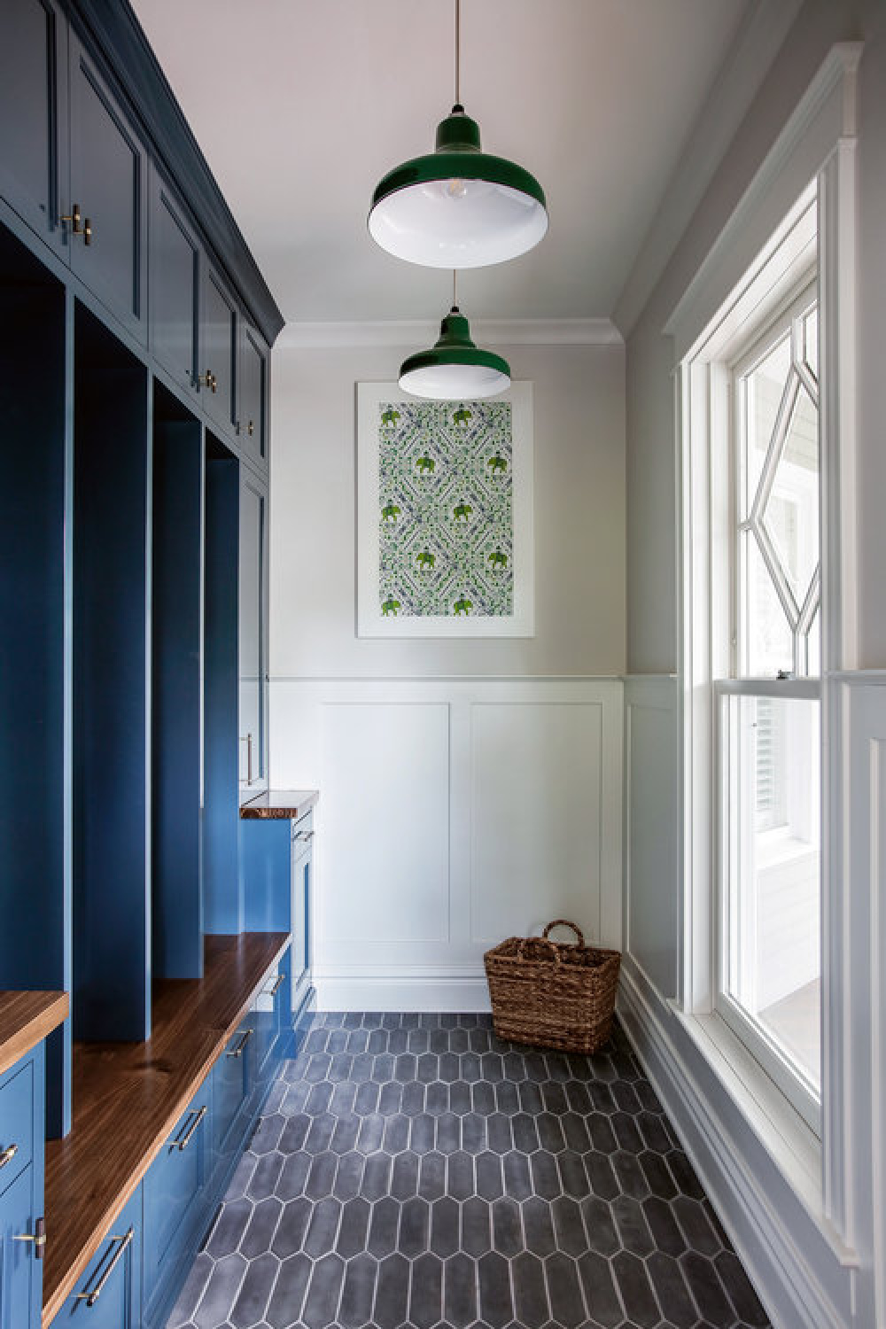 Blue painted custom cubies and cabinets in a traditional mud room by Edward Deegan Architects. #mudrooms #custommillwork #bluecabinets