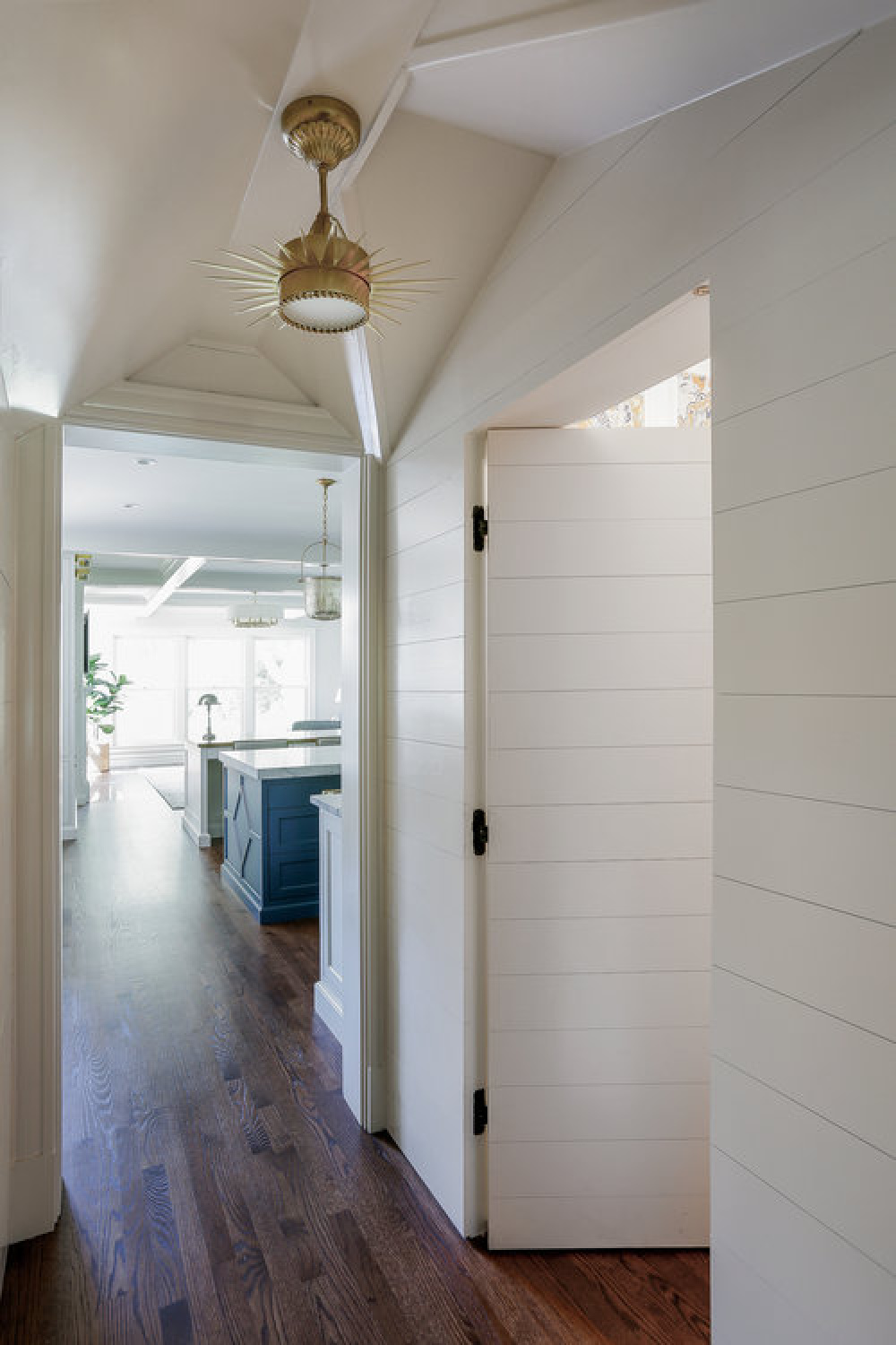 Classic style in a hallway with white shiplap and custom millwork by Edward Deegan Architects.