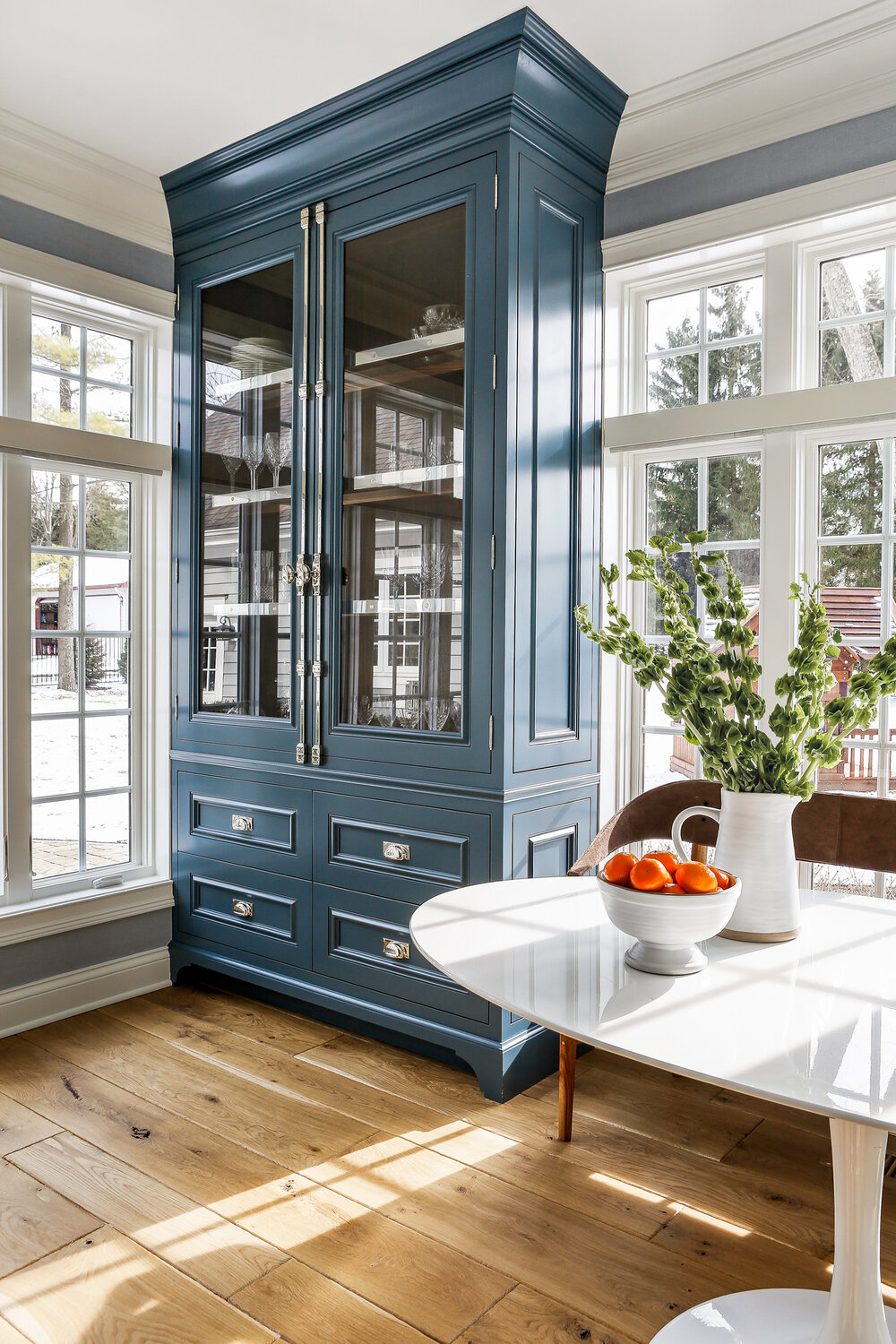 Beautiful blue tall cupboard and hutch with glass doors in a breakfast nook with traditional classic design by Edward Deegan Architects. #breakfastnook #bluecupboard #bluekitvhen