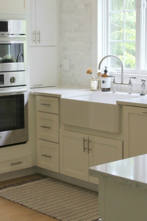 Classic white kitchen with fireclay farm sink - Hello Lovely Studio. #farmsink #classickitchen #kitchendesign #fireclaysink