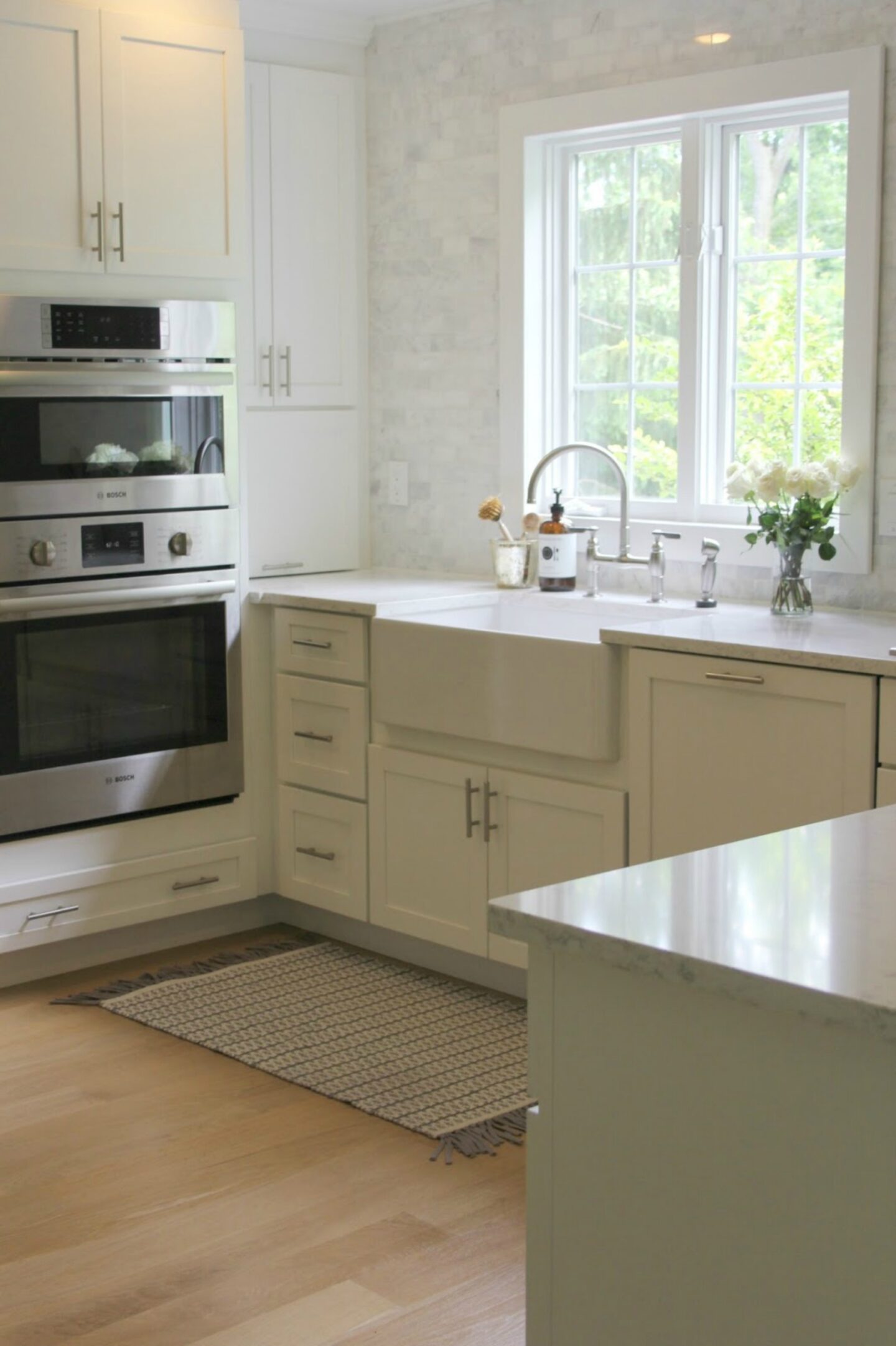 Classic white kitchen with fireclay farm sink - Hello Lovely Studio. #farmsink #classickitchen #kitchendesign #fireclaysink