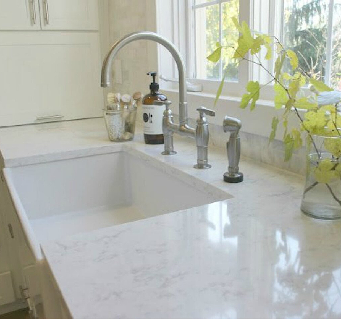 Classic white kitchen with fireclay farm sink - Hello Lovely Studio. #farmsink #classickitchen #kitchendesign #fireclaysink