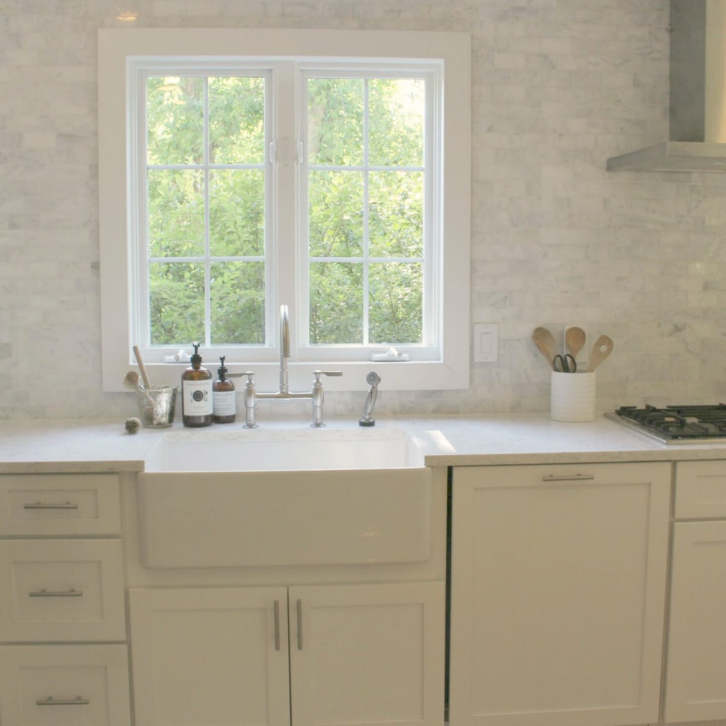 Classic white kitchen with fireclay farm sink - Hello Lovely Studio. #farmsink #classickitchen #kitchendesign #fireclaysink