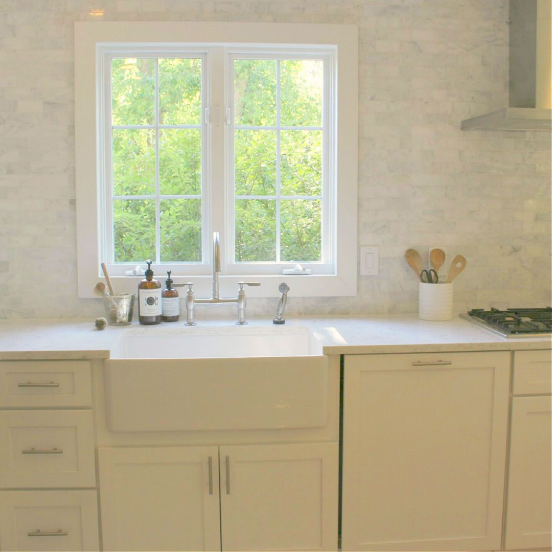 Classic white kitchen with fireclay farm sink - Hello Lovely Studio. #farmsink #classickitchen #kitchendesign #fireclaysink
