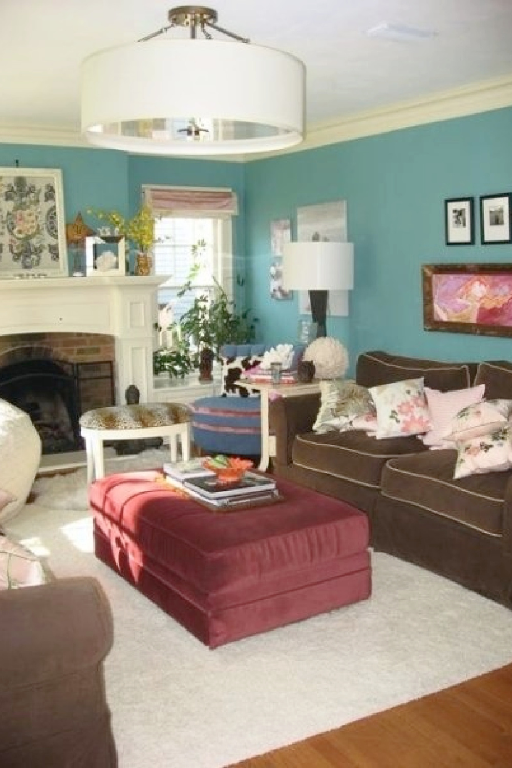 Turquoise walls and flea market beachy boho style in Jenny Sweeney's living room in a suburban Tudor home.