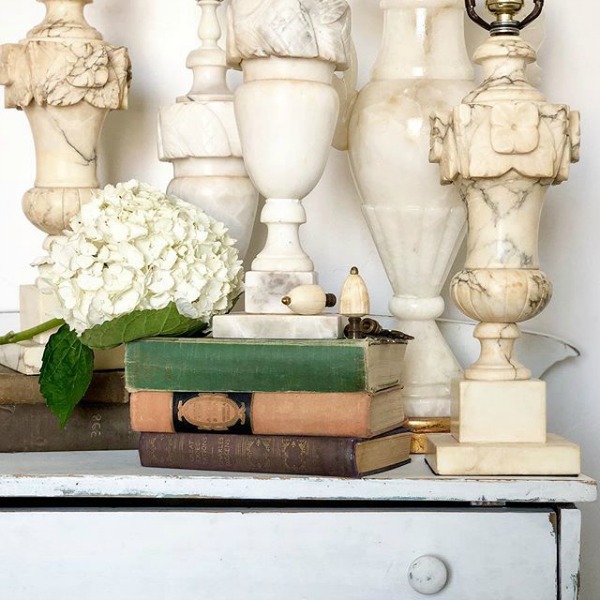 White vintage alabaster marble lamps grouped together in a rustic vignette by Le Cultivateur. #whitedecor #countrystyle #countrydecor #toneontone