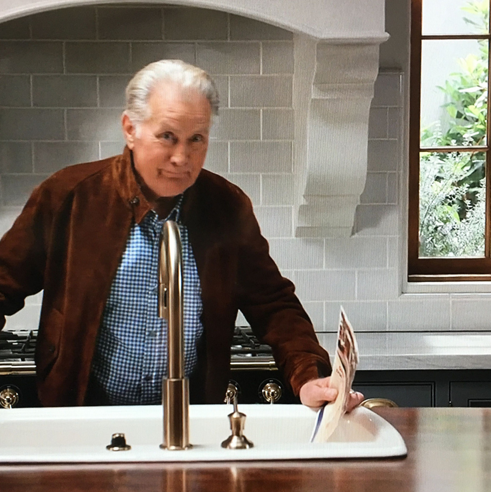 Robert and Sol kitchen from the set of GRACE & FRANKIE - a gorgeous eclectic design with Spanish tile, a French range, and a mix of marble and wood finishes. #graceandfrankie #robertandsol #interiordesign #setdesign