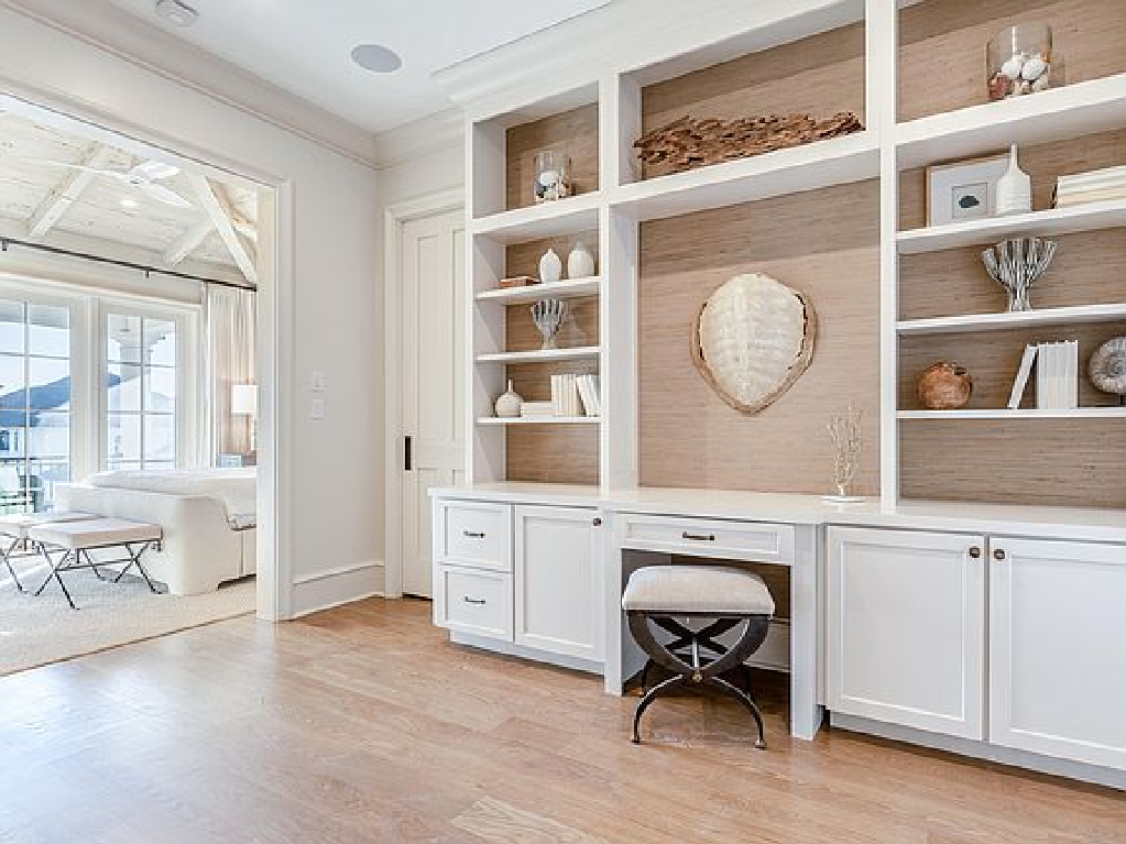 Traditional style built-ins in a sitting room adjacent to a tranquil coastal bedroom in Inlet Beach, FL. #interiordesign #bedroomdesign #builtins #sittingroom