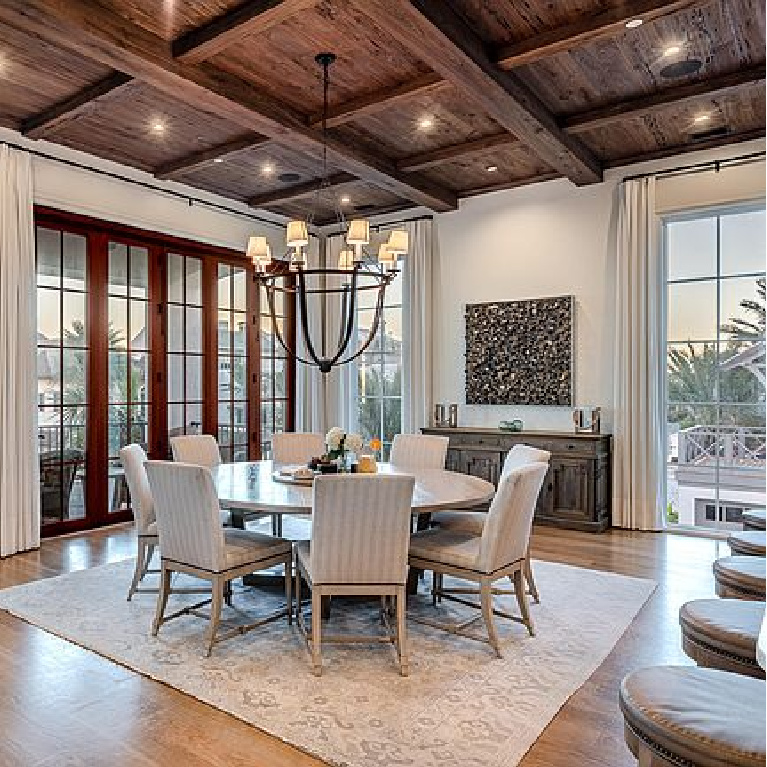 Luxurious coastal dining room with rustic wood ceiling in an Inlet Beach, FL home. #coastaldiningroom #woodceiling