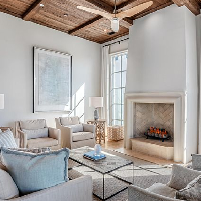 Sophisticated coastal living room with rustic wood ceiling in a luxury home in Inlet Beach, FL. #coastallivingroom #woodceiling