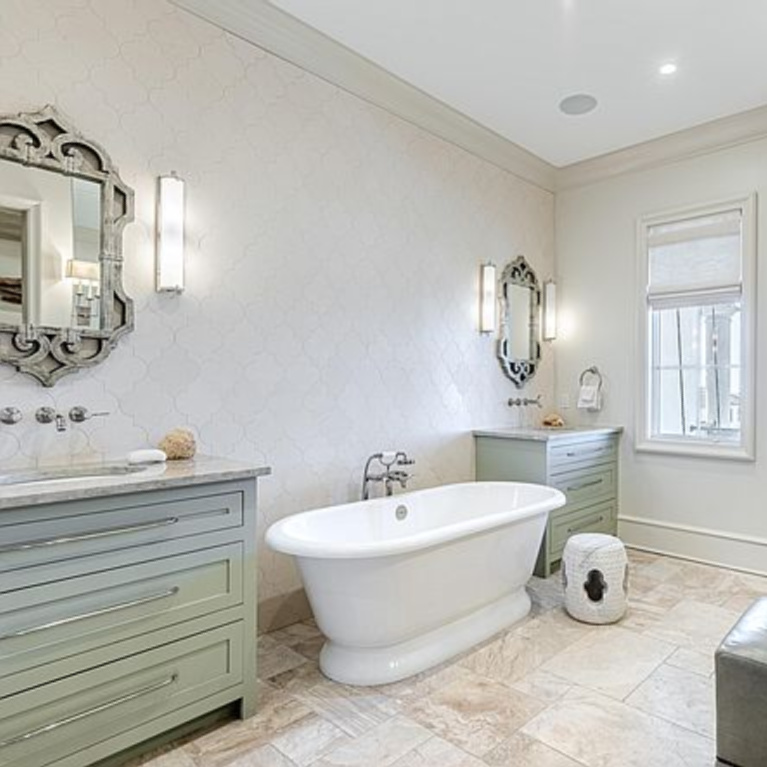 Luxurious French inspired bathroom with freestanding tub in a coastal Inlet Beach, FL home. #frenchcountry #bathroomdesign