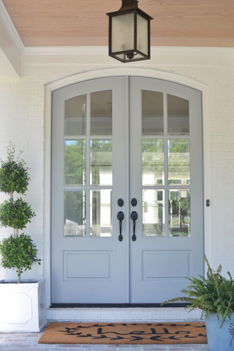 Extra White (Sherwin Williams) paint on house exterior with SW Uncertain Gray on doors and trim - ChrissyMarieBlog. #extrawhite #paintcolors #exteriorcolors