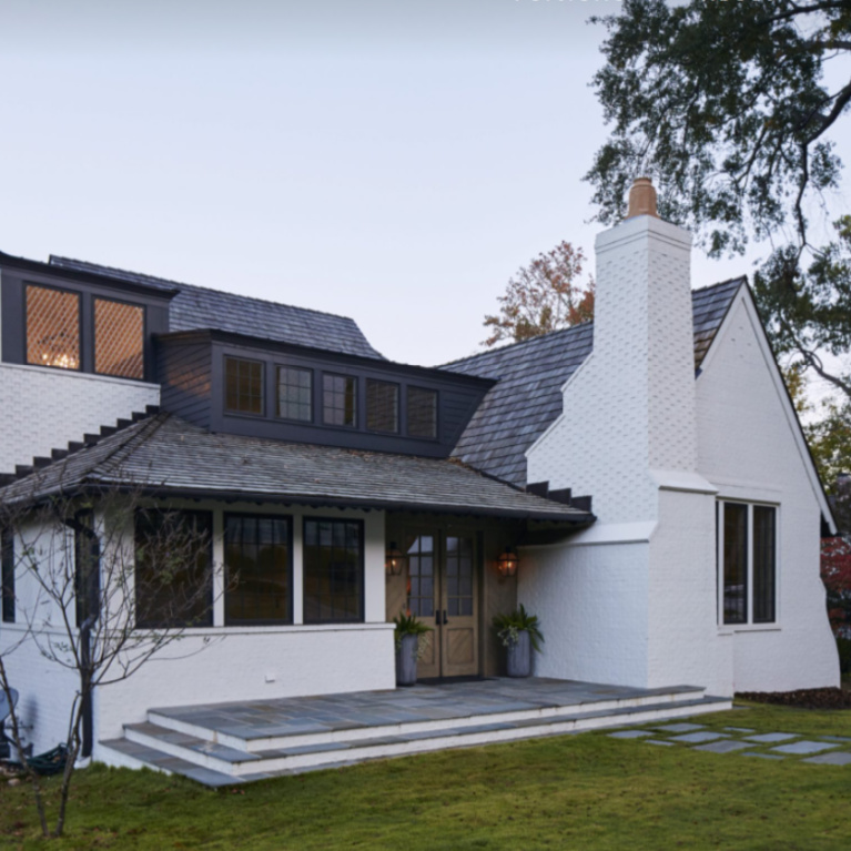 Nebulous White (Sherwin Williams) paint color on white brick exterior with SW Granite Peak for trim - LongandLongDesigns. #nebulouswhite #granitepeak #paintcolors #houseexteriors #exteriorcolors