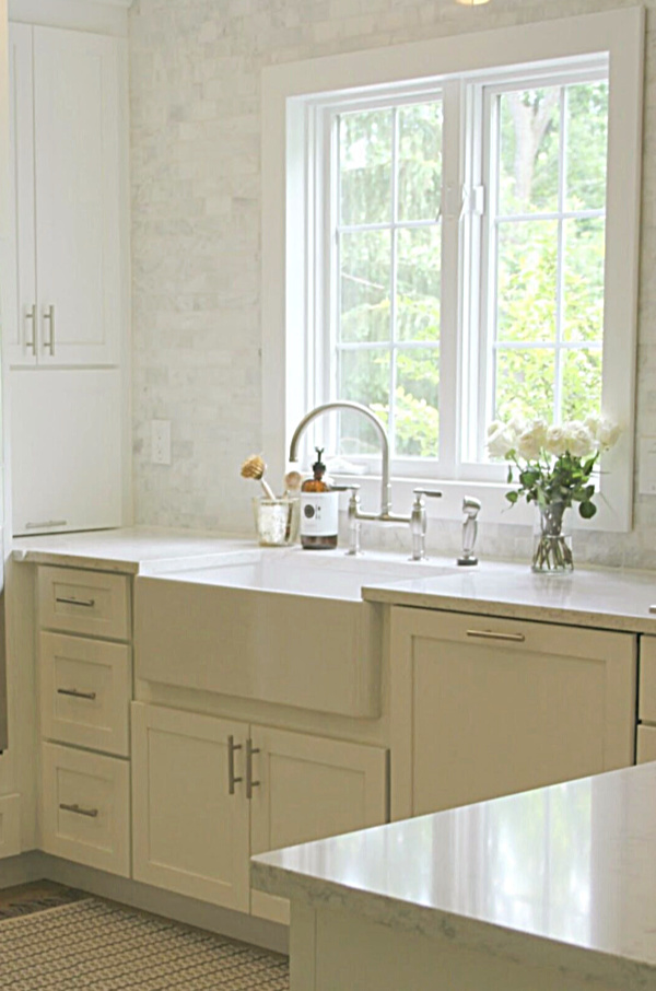 Apron front fireclay farm sink in our classic Shaker style kitchen with marble subway backsplash - Hello Lovely Studio. #farmsink #fireclay #shakerkitchen #hellolovelystudio #serenekitchen #kitchendesign