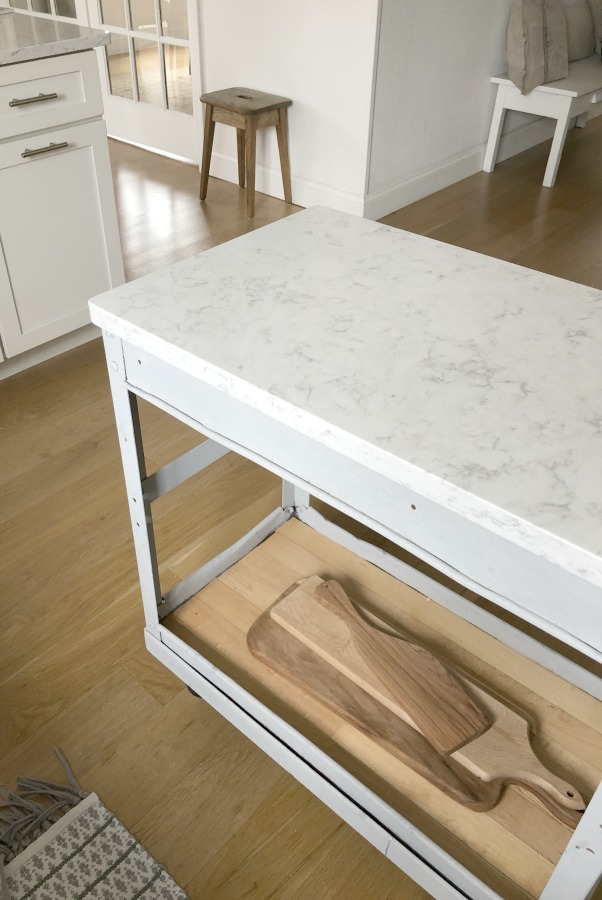 My simple white Shaker kitchen with white oak floors, marble subway backsplash, Viatera quartz "Minuet" counters, and a window seat. #hellolovelystudio #whiteshakerkitchen #kitchendesign #kitchendecor #classickitchen #viateraquartz #minuet
