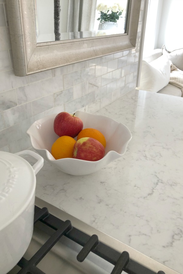 My simple white Shaker kitchen with white oak floors, marble subway backsplash, Viatera quartz "Minuet" counters, and a window seat. #hellolovelystudio #whiteshakerkitchen #kitchendesign #kitchendecor #classickitchen #viateraquartz #minuet